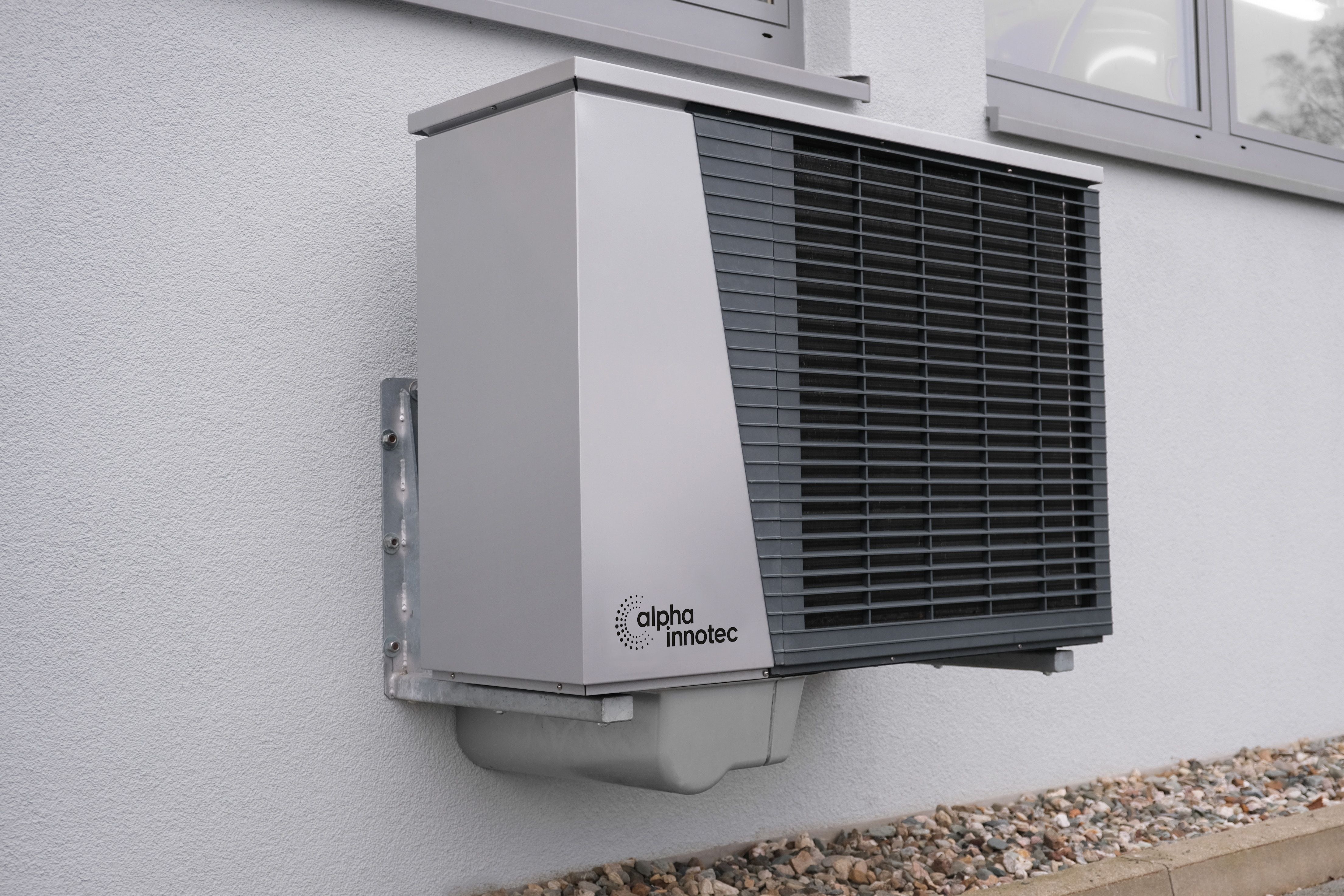 Heat pump outdoor unit on a modern New Zealand home